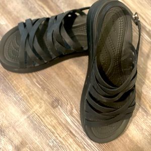 Black platform crocs.